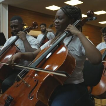 globo-canal-5-20250207-1844-frame-266630.jpeg Celebrando 15 Anos de Impacto: A Revolução Musical da Orquestra Maré do Amanhã